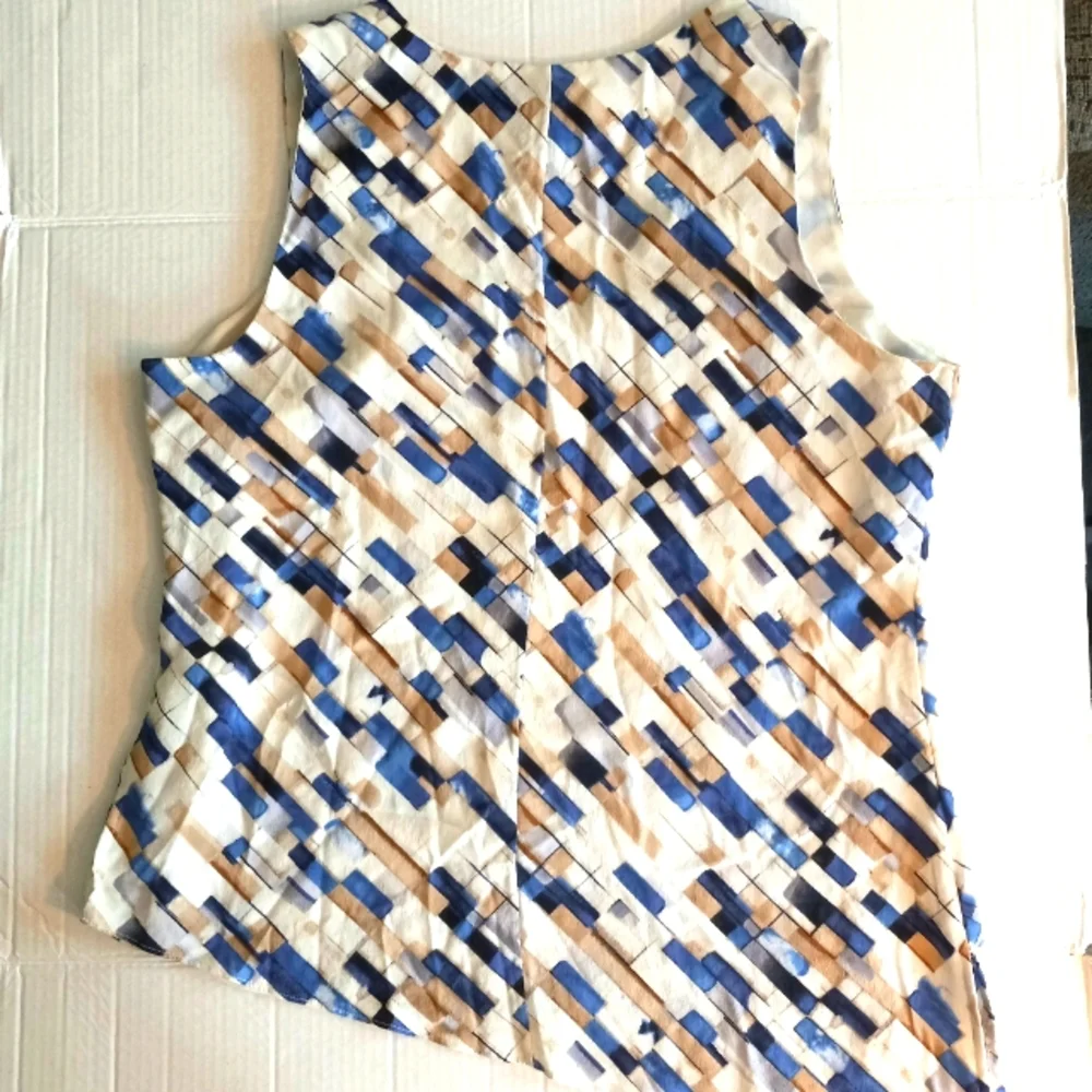 White House Black Market silk assymetrical sleeveless top with geometric…